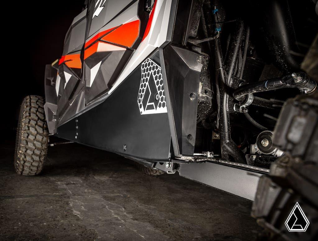 Picture from the rear side angle of the Assault Industries Polaris RZR XP 4 1000 Rock Sliders