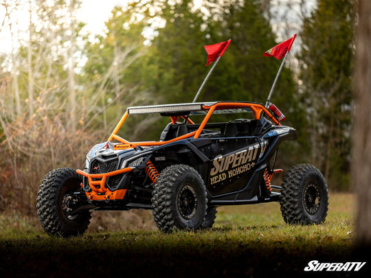 Picture from the front left side with the Can-Am Maverick X3 Long Travel Kit Boxed A-Arms