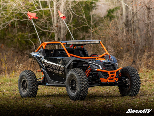 Picture from the front right side with the Can-Am Maverick X3 Long Travel Kit Boxed A-Arms